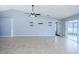 Bright living room, tile floors and sliding glass doors at 5627 War Admiral Dr, Wesley Chapel, FL 33544