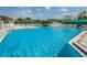 Large community pool with plenty of lounge chairs at 5627 War Admiral Dr, Wesley Chapel, FL 33544