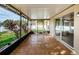 Spacious screened patio with tile flooring and string lights at 5627 War Admiral Dr, Wesley Chapel, FL 33544