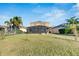 House with a screened patio and fenced backyard at 708 Fern Leaf Dr, Ruskin, FL 33570