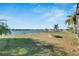 Lake view from grassy backyard at 708 Fern Leaf Dr, Ruskin, FL 33570