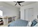 Bedroom with built-in desk, large closet, and neutral decor at 708 Fern Leaf Dr, Ruskin, FL 33570