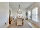 Bright dining room with light wood table and seating for six at 708 Fern Leaf Dr, Ruskin, FL 33570