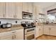 Kitchen features granite countertops and stainless steel appliances at 708 Fern Leaf Dr, Ruskin, FL 33570