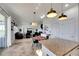 Kitchen with island, dining area, and open floor plan at 708 Fern Leaf Dr, Ruskin, FL 33570