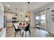 Kitchen with island, dining area, and view of backyard at 708 Fern Leaf Dr, Ruskin, FL 33570