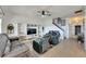 Open living room with a built-in entertainment center and hardwood floors at 708 Fern Leaf Dr, Ruskin, FL 33570
