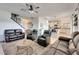 Spacious living room with leather furniture and a view into the kitchen at 708 Fern Leaf Dr, Ruskin, FL 33570
