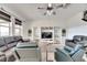 Spacious living room with dark leather sofas and built-in shelving at 708 Fern Leaf Dr, Ruskin, FL 33570