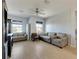 Light and airy living room with light wood floors and comfy seating at 708 Fern Leaf Dr, Ruskin, FL 33570