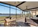 Relaxing screened patio overlooking lake with seating at 708 Fern Leaf Dr, Ruskin, FL 33570