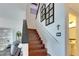 Modern staircase with dark wood treads and white risers at 708 Fern Leaf Dr, Ruskin, FL 33570