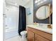 Clean bathroom, featuring a tub, shower, and wood vanity at 5935 Maidenstone Way, Palmetto, FL 34221