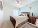 Spacious bedroom with a king bed and accent wall at 5935 Maidenstone Way, Palmetto, FL 34221