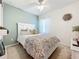 Charming bedroom with a queen bed and colorful bedding at 5935 Maidenstone Way, Palmetto, FL 34221