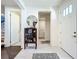 Bright entryway with tile floors and a half bath at 5935 Maidenstone Way, Palmetto, FL 34221