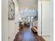 Bright entryway with hardwood floors and views into the living room and kitchen at 5935 Maidenstone Way, Palmetto, FL 34221