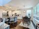 Eat-in kitchen with island, hardwood floors, and modern lighting fixtures at 5935 Maidenstone Way, Palmetto, FL 34221