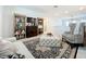 Bright loft with comfortable seating and a large rug at 5935 Maidenstone Way, Palmetto, FL 34221