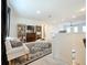 Spacious loft area with seating, TV, and decorative rug at 5935 Maidenstone Way, Palmetto, FL 34221