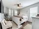 Spacious bedroom with king-size bed, hardwood floors, and neutral decor at 5935 Maidenstone Way, Palmetto, FL 34221