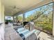 Spacious screened porch with seating and outdoor grill at 5935 Maidenstone Way, Palmetto, FL 34221