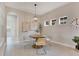 Charming breakfast nook with wood table, neutral decor, and natural light at 7506 Parkshore Dr, Apollo Beach, FL 33572