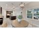 Bright kitchen nook with casual dining area, pendant lighting and view to living area at 7506 Parkshore Dr, Apollo Beach, FL 33572