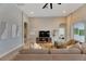 Relaxing living room featuring sectional sofa, large TV and access to other rooms at 7506 Parkshore Dr, Apollo Beach, FL 33572