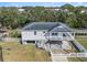 Elevated view of a waterfront home with private dock and fenced yard at 9107 Brunswick Ln, Tampa, FL 33615