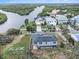Aerial view showcasing the home's waterfront location and neighborhood at 9107 Brunswick Ln, Tampa, FL 33615