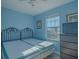 Bedroom with two twin-size beds and a window at 9107 Brunswick Ln, Tampa, FL 33615
