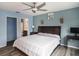 Spacious bedroom with king-size bed, en-suite bathroom, and walk-in closet at 9107 Brunswick Ln, Tampa, FL 33615