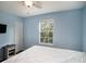 Bedroom with a king-size bed and water view at 9107 Brunswick Ln, Tampa, FL 33615