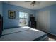 Bedroom with two twin-size beds and a large window at 9107 Brunswick Ln, Tampa, FL 33615