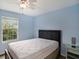 Bedroom with a queen-size bed and water view at 9107 Brunswick Ln, Tampa, FL 33615