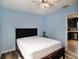 Bedroom with a full-size bed and access to kitchen at 9107 Brunswick Ln, Tampa, FL 33615