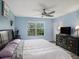 Bright bedroom with king-size bed and large window at 9107 Brunswick Ln, Tampa, FL 33615