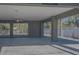 Covered parking area with ceiling fan and backyard view at 9107 Brunswick Ln, Tampa, FL 33615