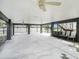 Spacious covered patio with ceiling fan and seating area at 9107 Brunswick Ln, Tampa, FL 33615