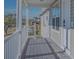Inviting front porch with white railing and entryway at 9107 Brunswick Ln, Tampa, FL 33615