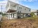Two-story house, elevated, with fenced yard at 9107 Brunswick Ln, Tampa, FL 33615