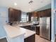 Modern kitchen features stainless steel appliances and ample cabinetry at 9107 Brunswick Ln, Tampa, FL 33615