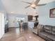 Open living room with hardwood floors and comfortable seating at 9107 Brunswick Ln, Tampa, FL 33615