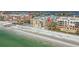 Aerial view of condo complex on the beach, featuring pool, and lush landscaping at 16308 Gulf Blvd # 303, Redington Beach, FL 33708