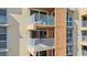 Exterior view of multi-level balconies with patio furniture at 16308 Gulf Blvd # 303, Redington Beach, FL 33708