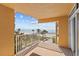 Balcony view of the ocean, beach, and palm trees at 16308 Gulf Blvd # 303, Redington Beach, FL 33708