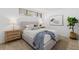 Bedroom features an upholstered bed frame, modern decor, and ample light at 16308 Gulf Blvd # 303, Redington Beach, FL 33708