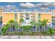 Apartment building with palm trees and neatly manicured landscaping at 16308 Gulf Blvd # 303, Redington Beach, FL 33708