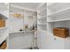 Spacious walk-in closet with custom shelving, drawers, and ample storage space at 16308 Gulf Blvd # 303, Redington Beach, FL 33708